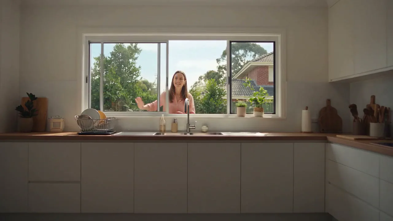 Erin at the kitchen window during an inspection